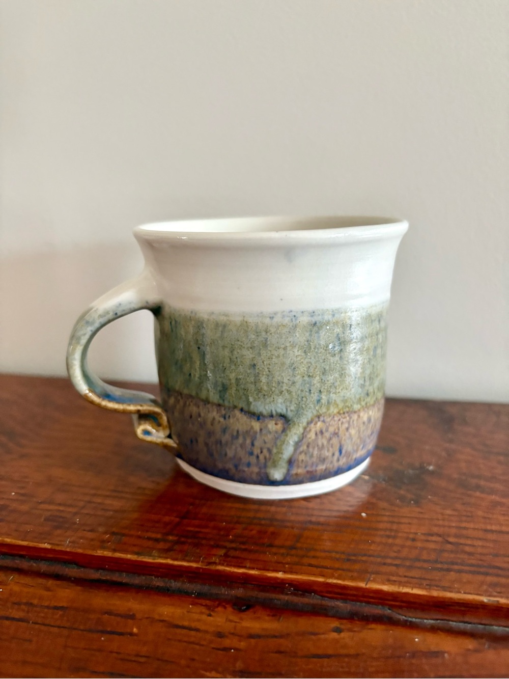 Signed Pottery Mug in White and Green Drip Glaze with Monster